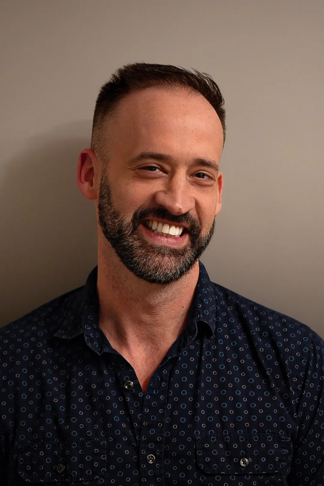 A natural, relaxed headshot in soft daylight